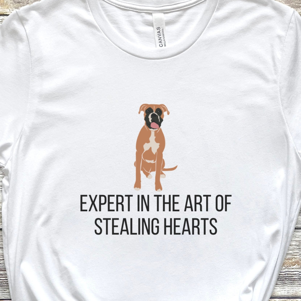"Expert in the art of stealing hearts" Unisex Tee